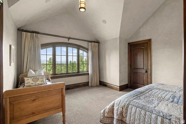Arched picture window with scenic natural backdrop
