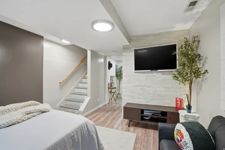 Finished lower level featuring wood-finish flooring and recessed lighting