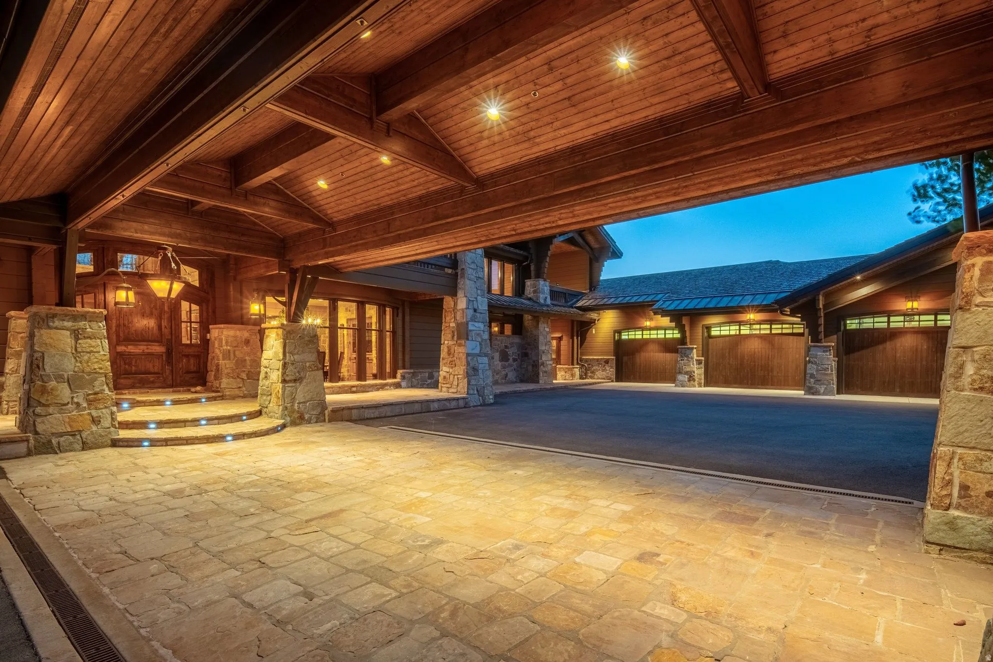 Covered entryway with natural wood ceiling beams