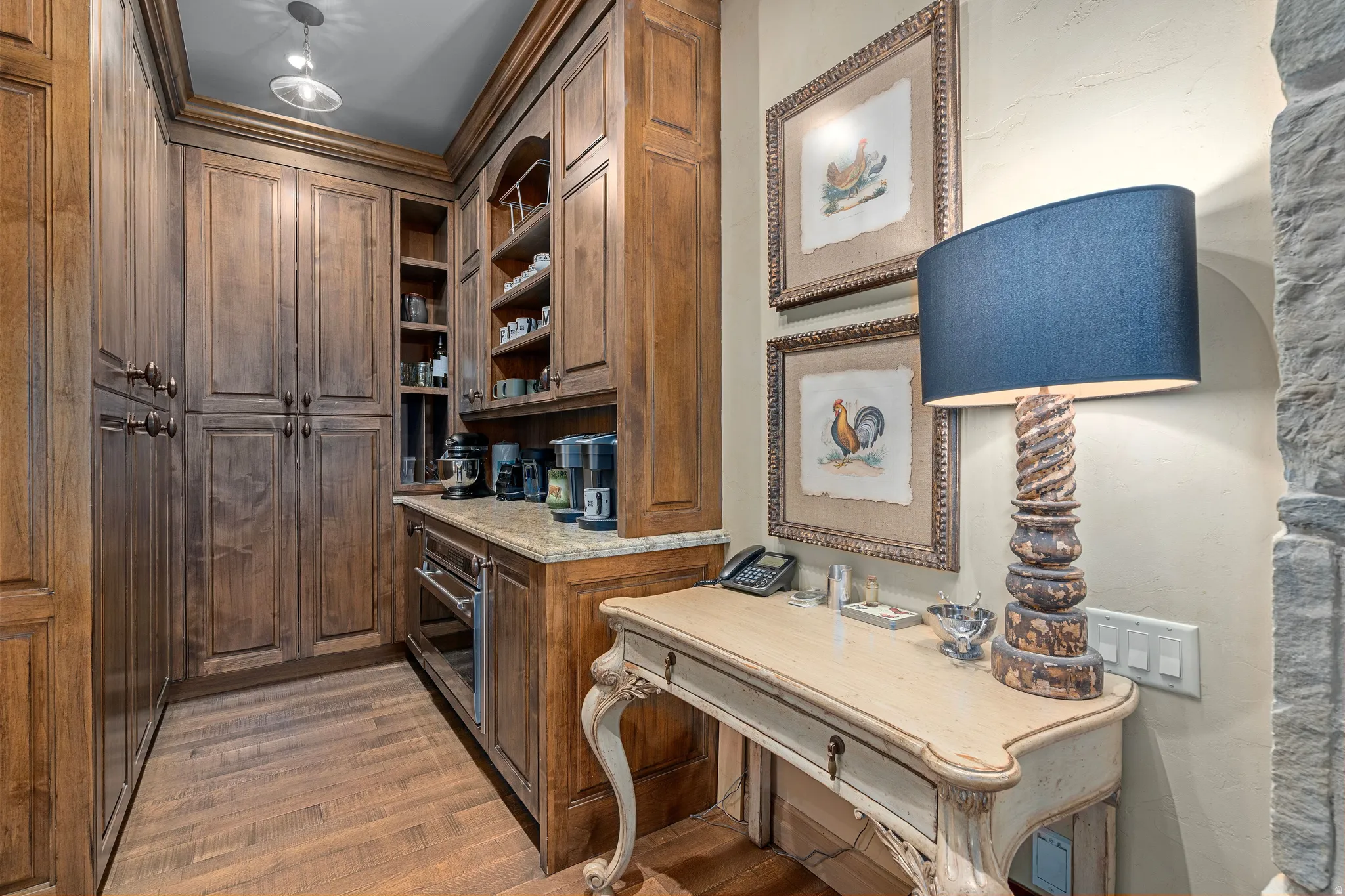 Custom wood cabinetry and shelving with integrated counter space and a built-in appliance