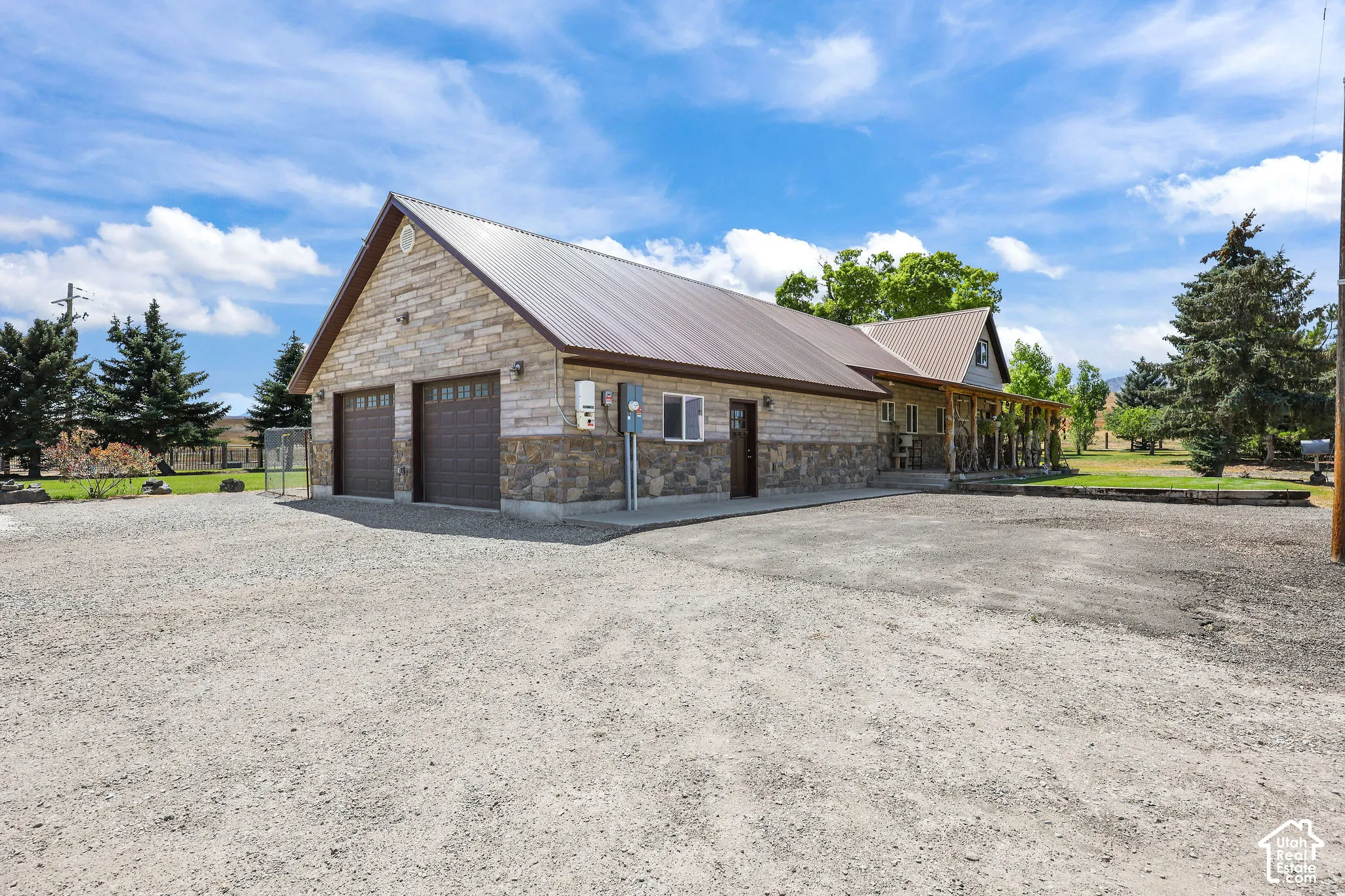 Stone and wood-finish exterior with a metal roof