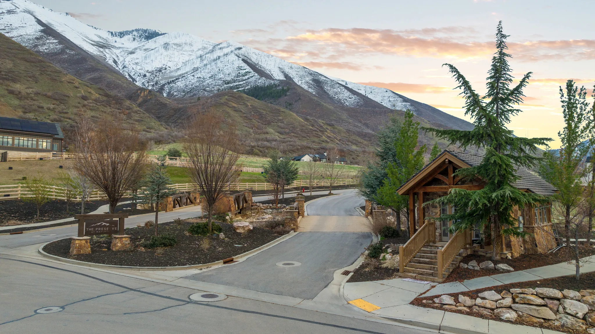 Entryway structure featuring natural stone veneer and exposed timber framing