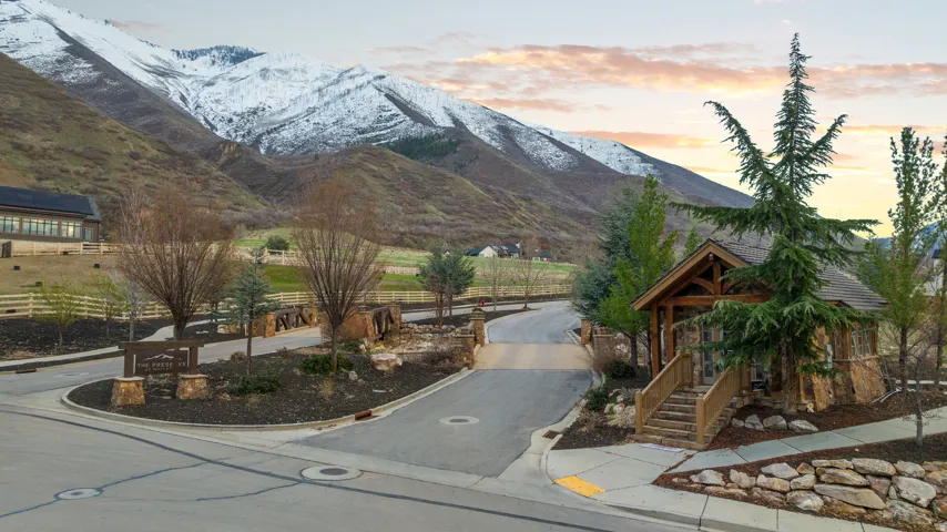 Entryway structure featuring natural stone veneer and exposed timber framing
