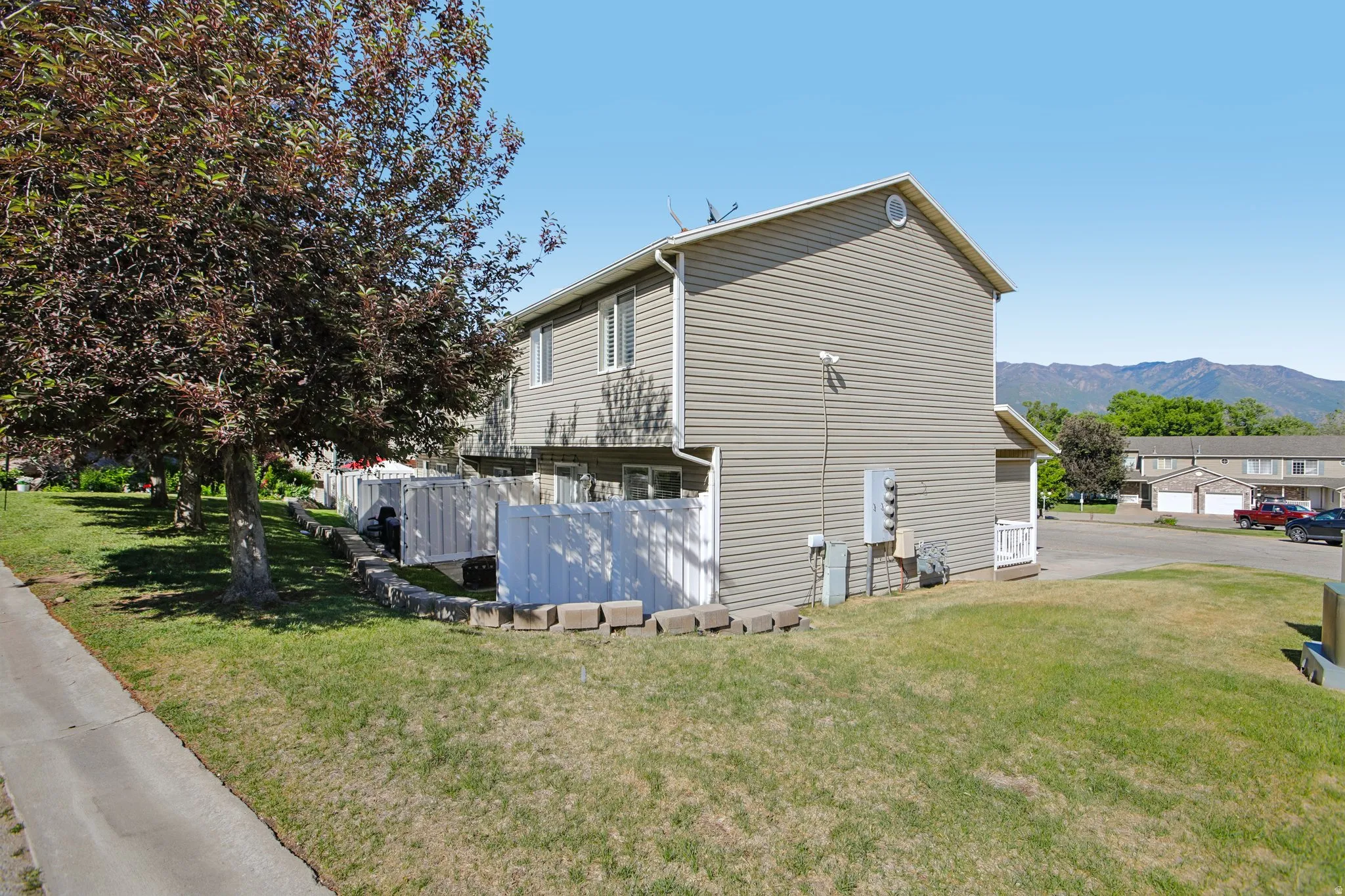 Two-story residential structure featuring horizontal siding and a gable roofline