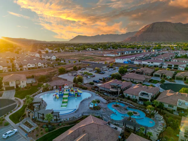 Community pool and waterpark featuring multiple slides and structures