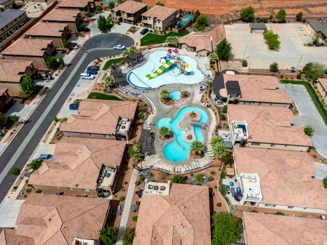 Aerial perspective showcasing a community pool area with multiple water features
