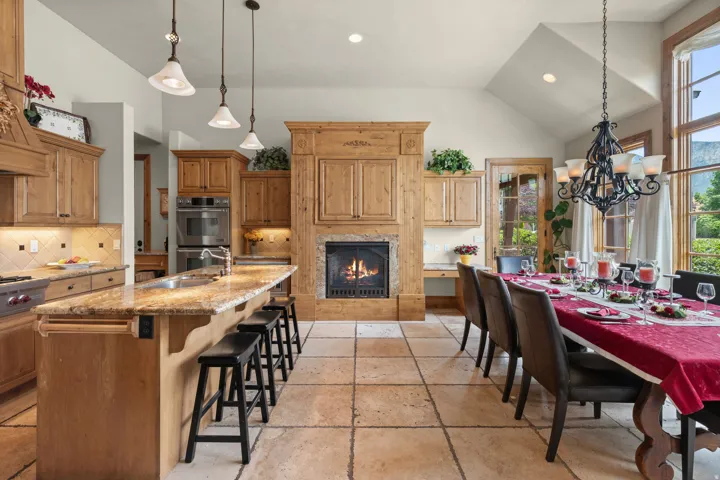 Kitchen/Dining Area with Fireplace, Wolf Gas Range and Double Ovens