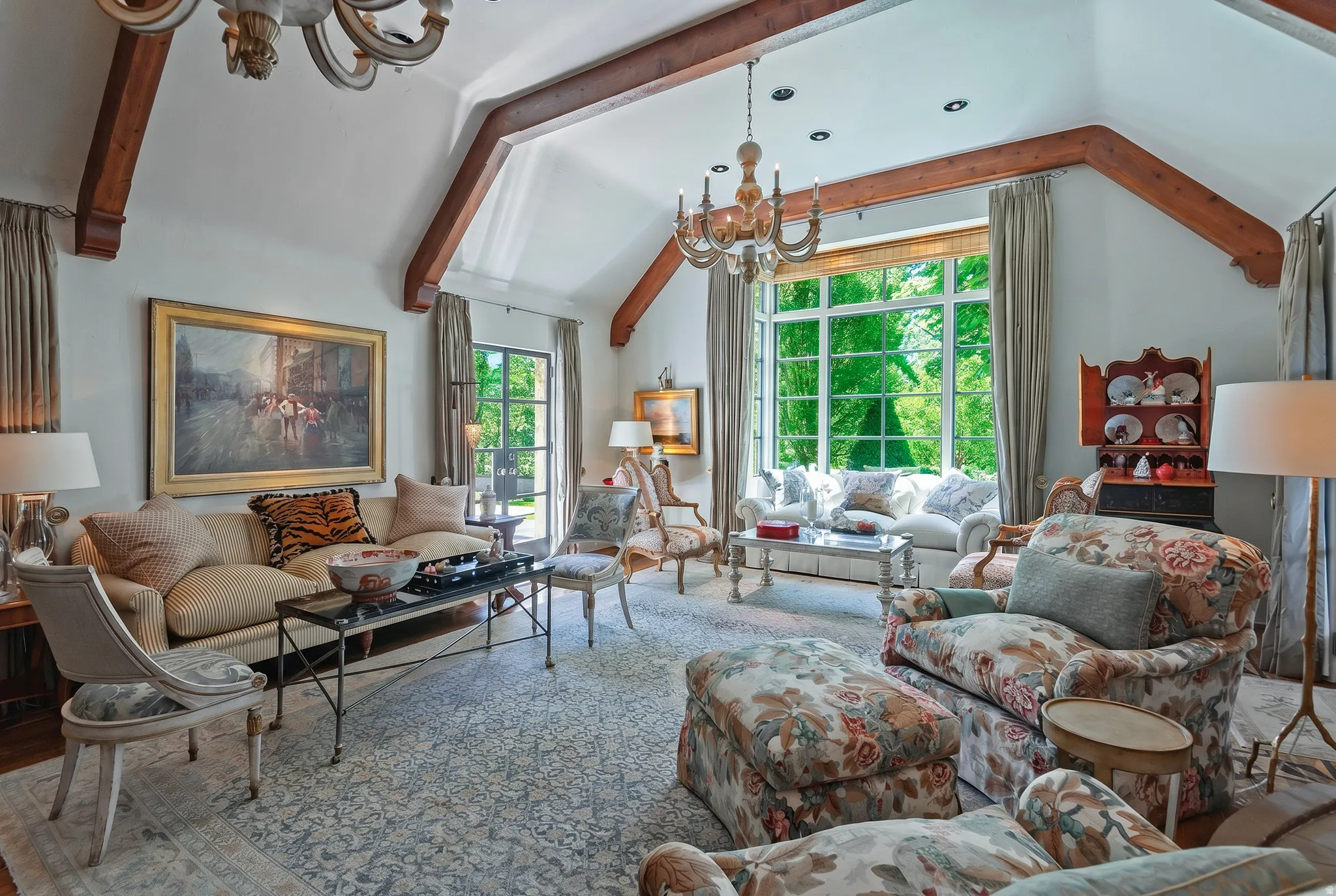 Vaulted ceiling featuring exposed wood beams