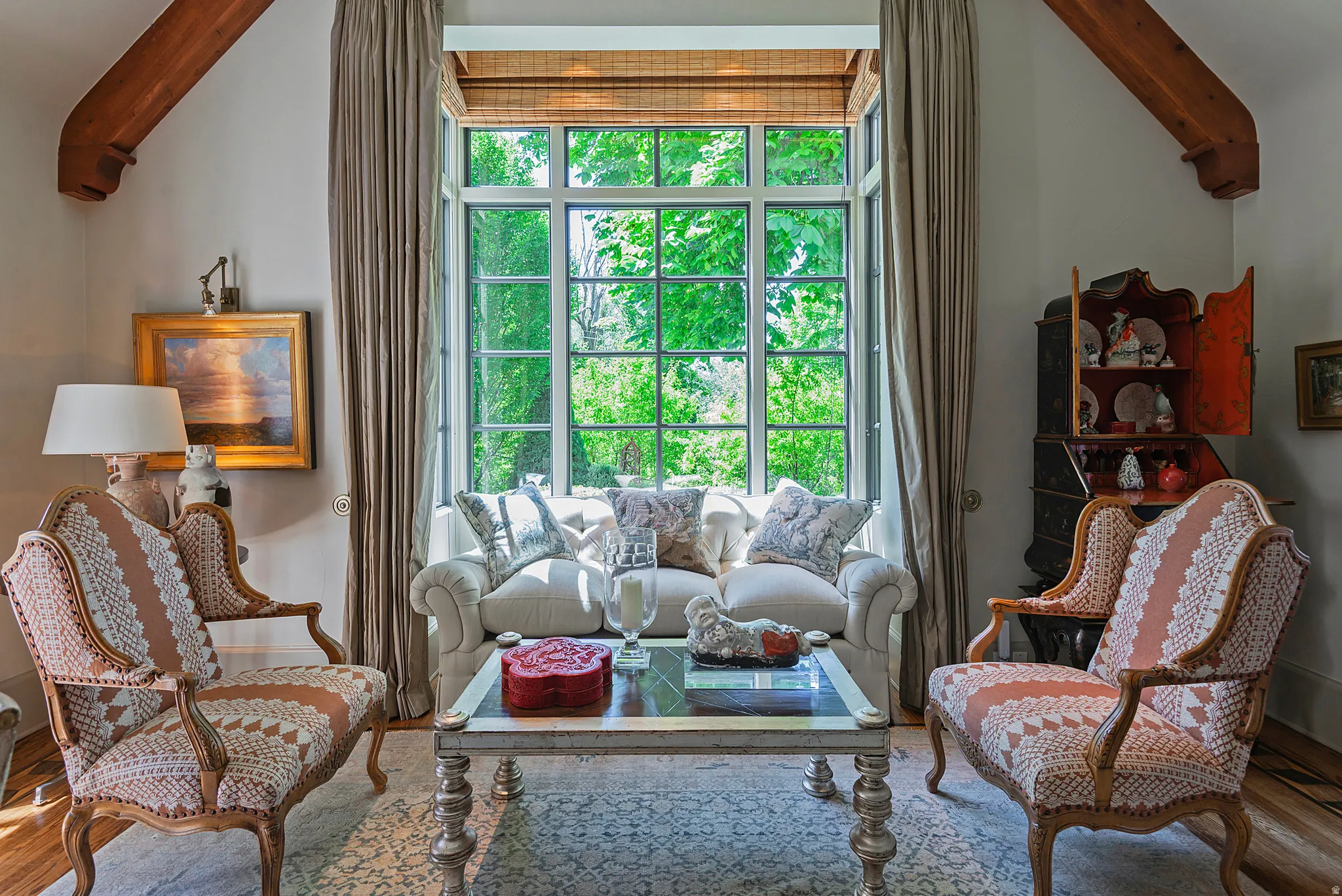 Vaulted ceiling featuring exposed wood beams