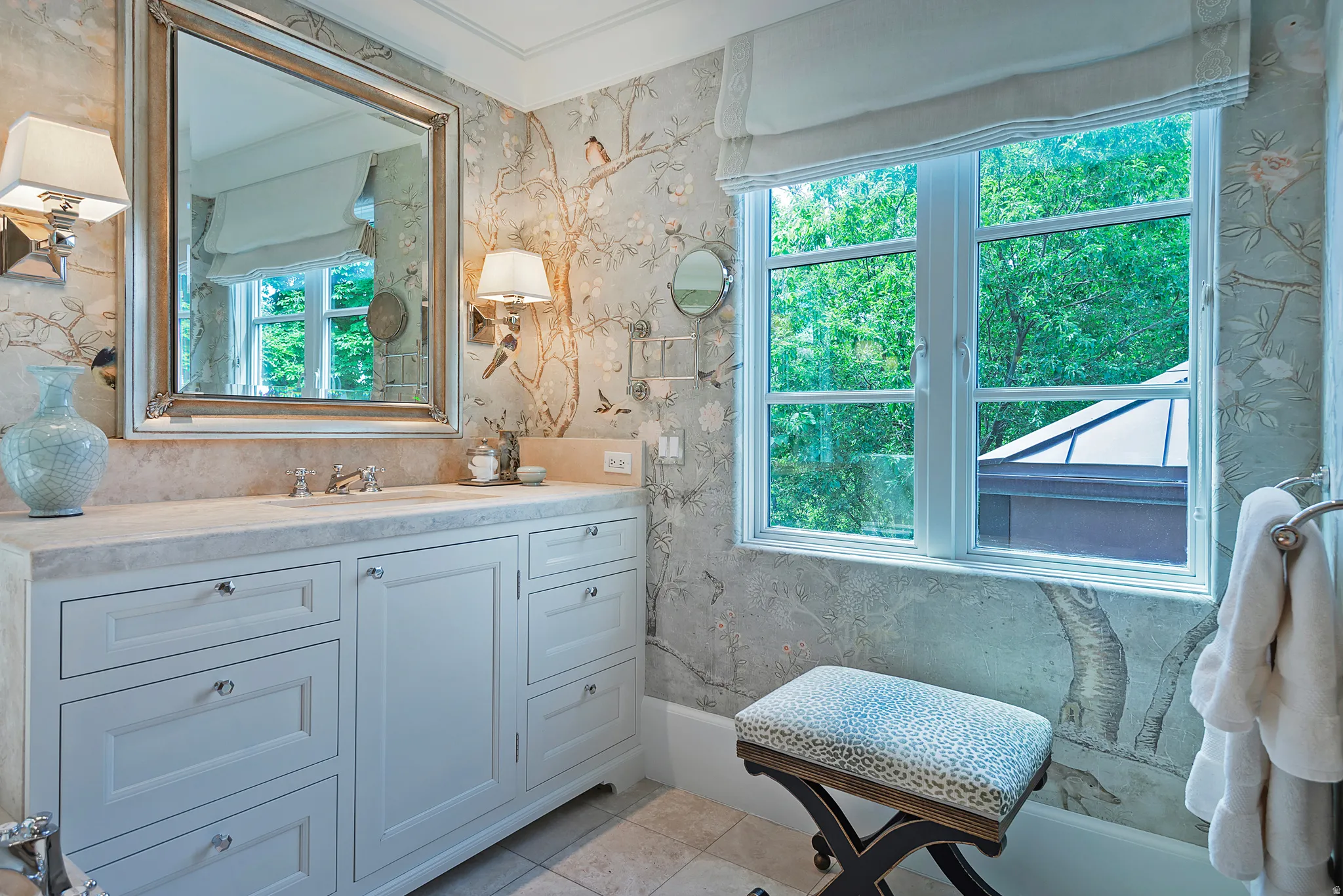 Vanity featuring a stone countertop with an integrated sink and brushed nickel faucet