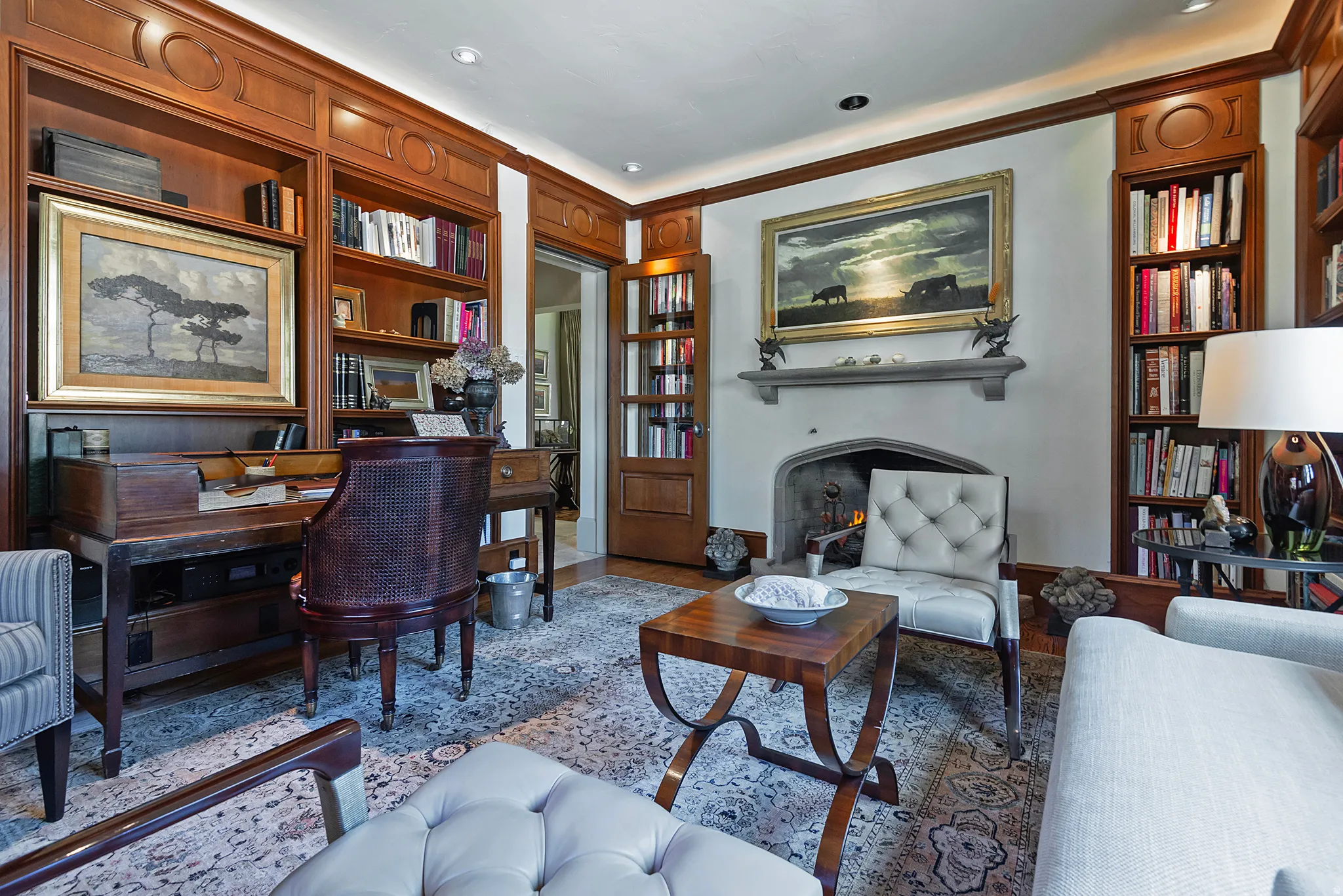 Room featuring extensive built-in wood cabinetry and shelving