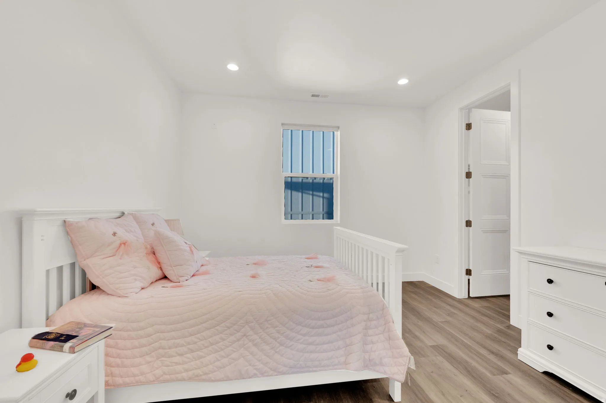 Bright interior space featuring wood-finish flooring and a neutral color palette