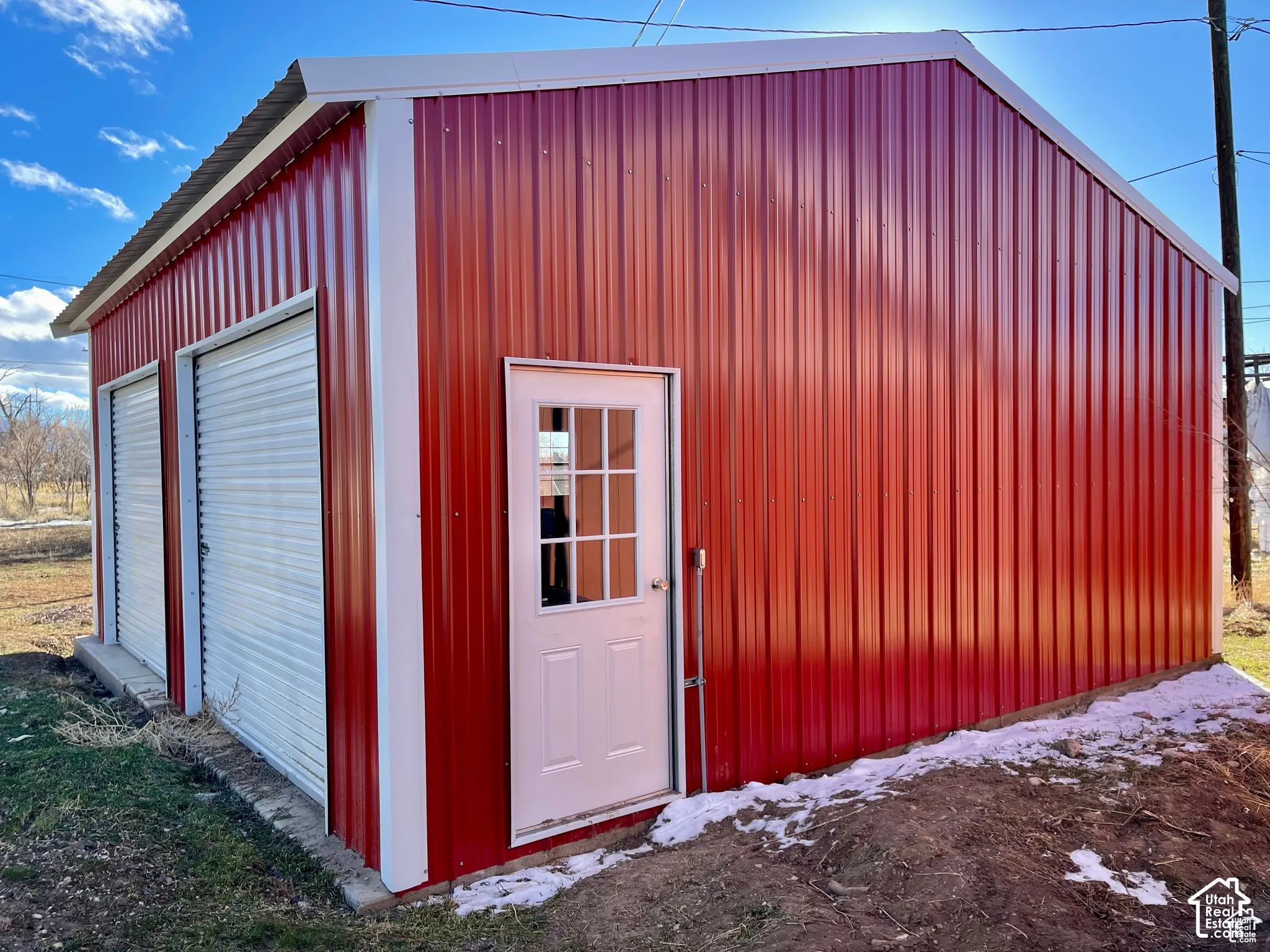 Red corrugated metal exterior with white trim