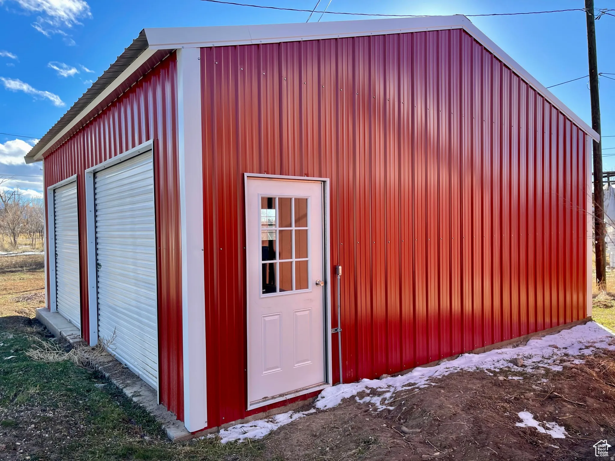 Red corrugated metal exterior with white trim