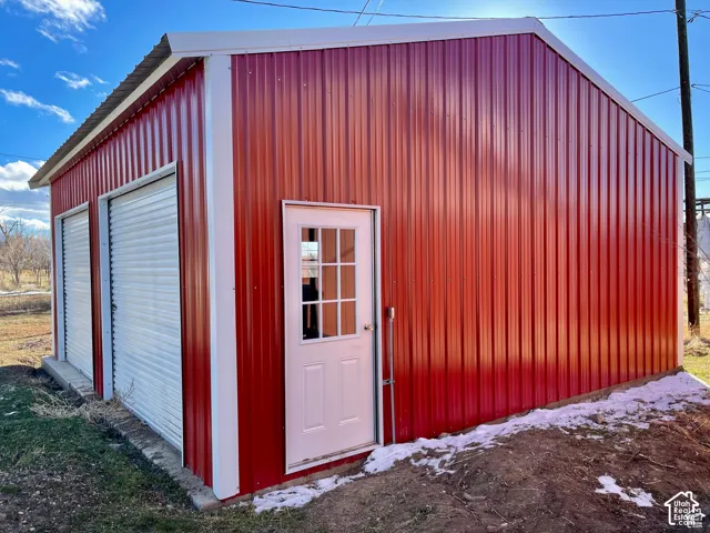 Red corrugated metal exterior with white trim