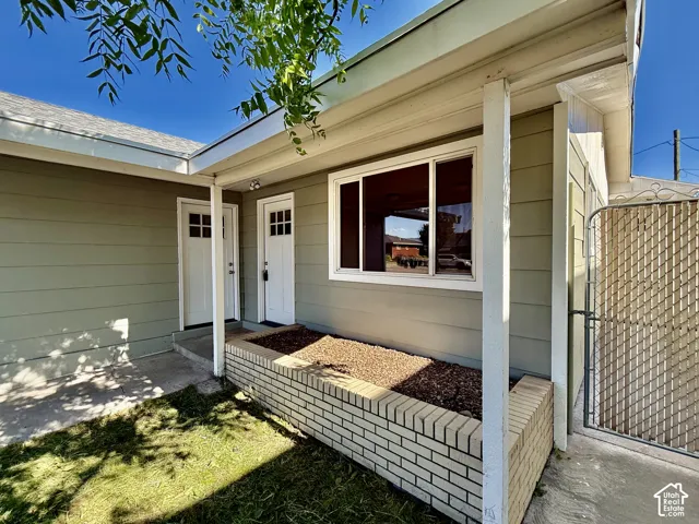 Light green horizontal siding with white trim
