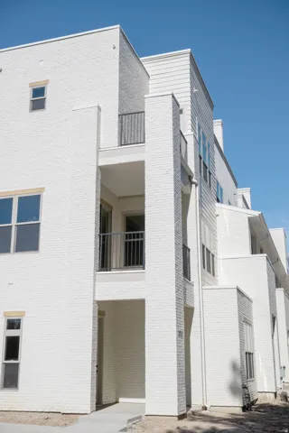Contemporary architecture featuring white painted brick and horizontal siding