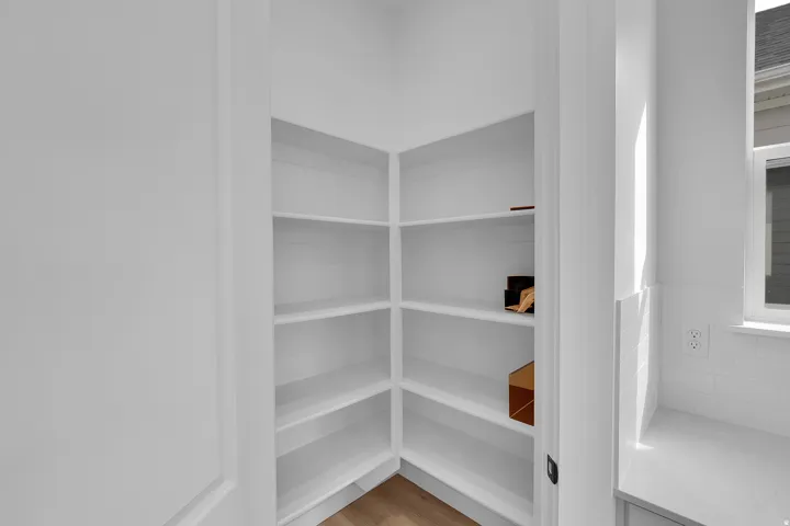 Built-in pantry shelving featuring multiple tiers of storage