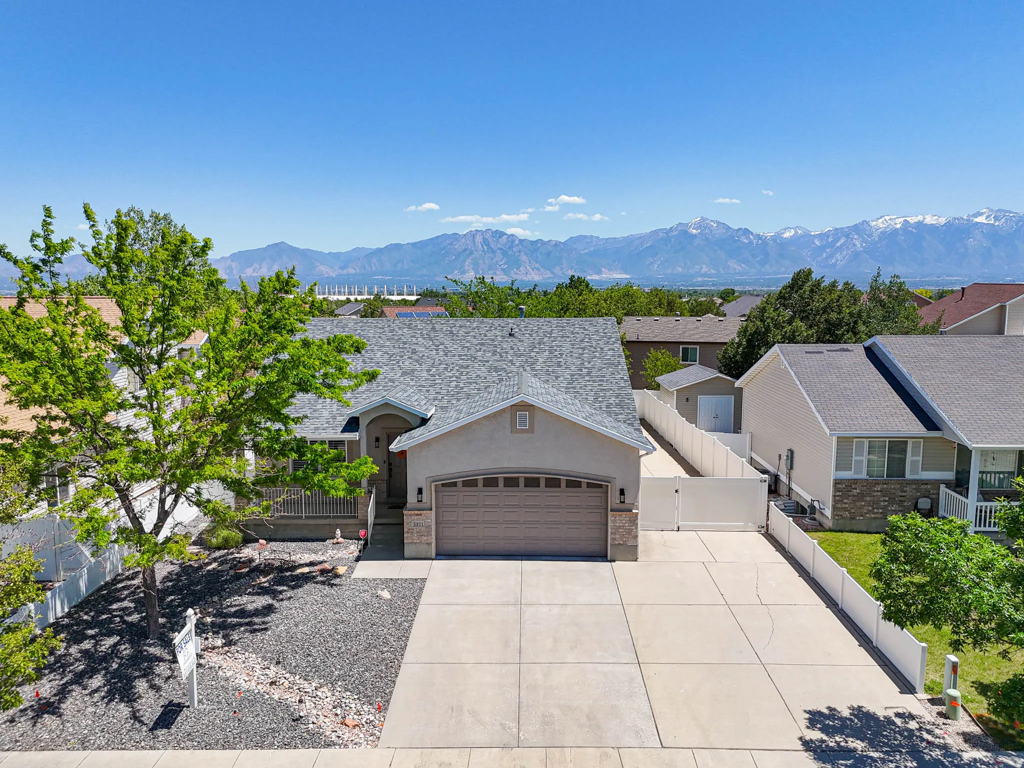 Single-family residence featuring a two-car garage, concrete driveway, and front porch