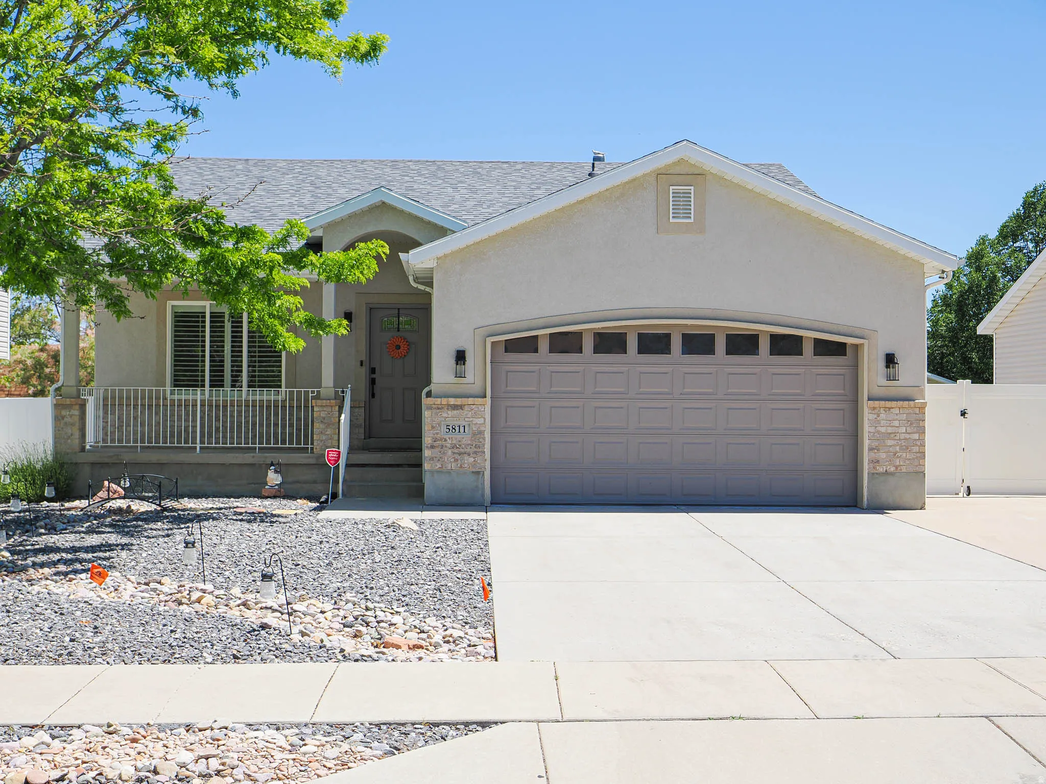 Contemporary facade with stucco siding and stone accents