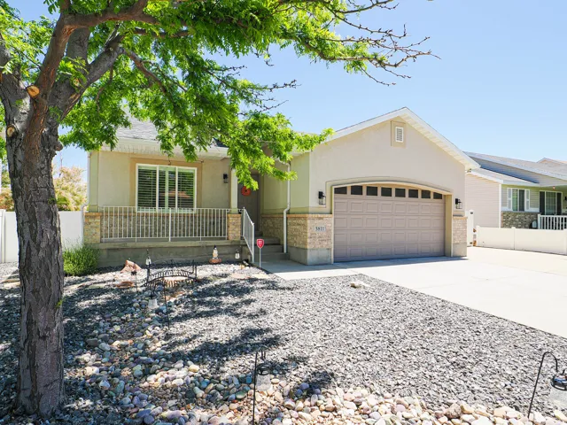 Single-story residence featuring a stucco exterior and an attached two-car garage