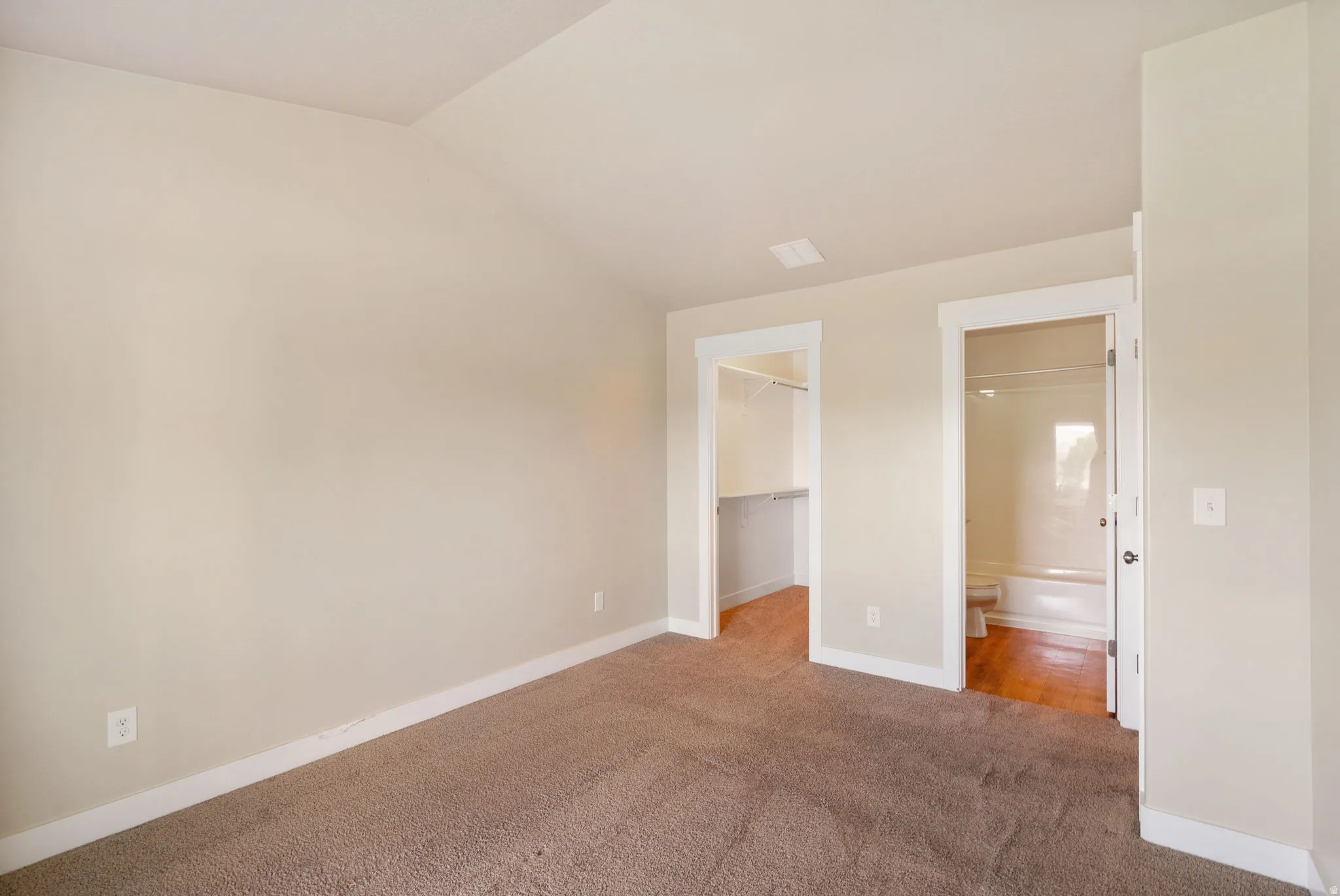 Primary Bedroom, facing walk in closet and primary bathroom.