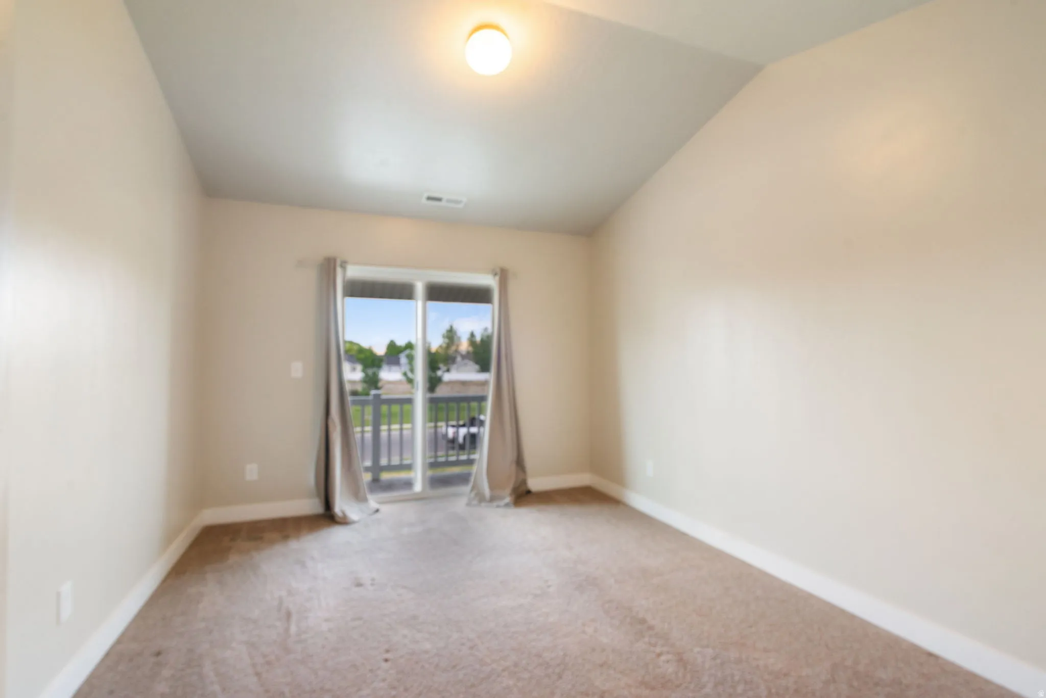 Primary Bedroom with balcony access.