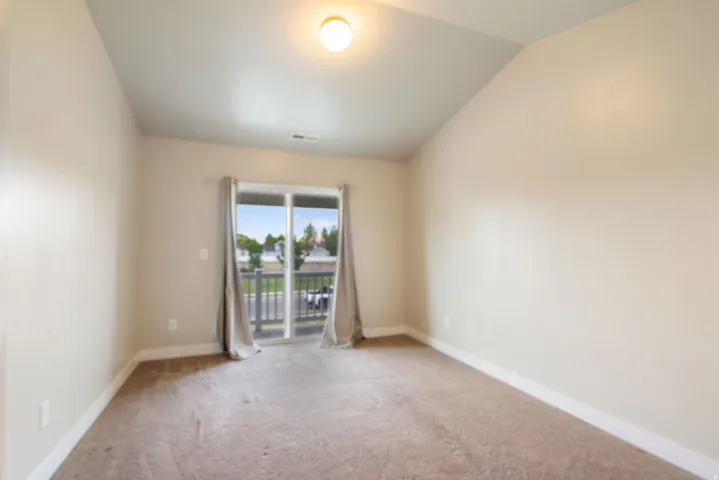 Primary Bedroom with balcony access.