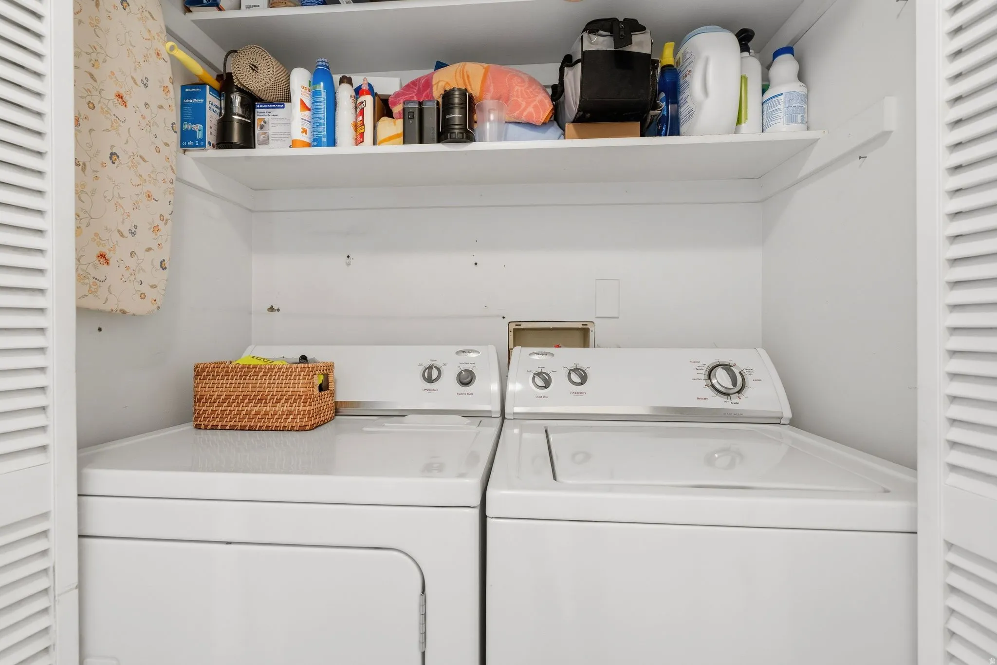 Dedicated laundry closet with shelf