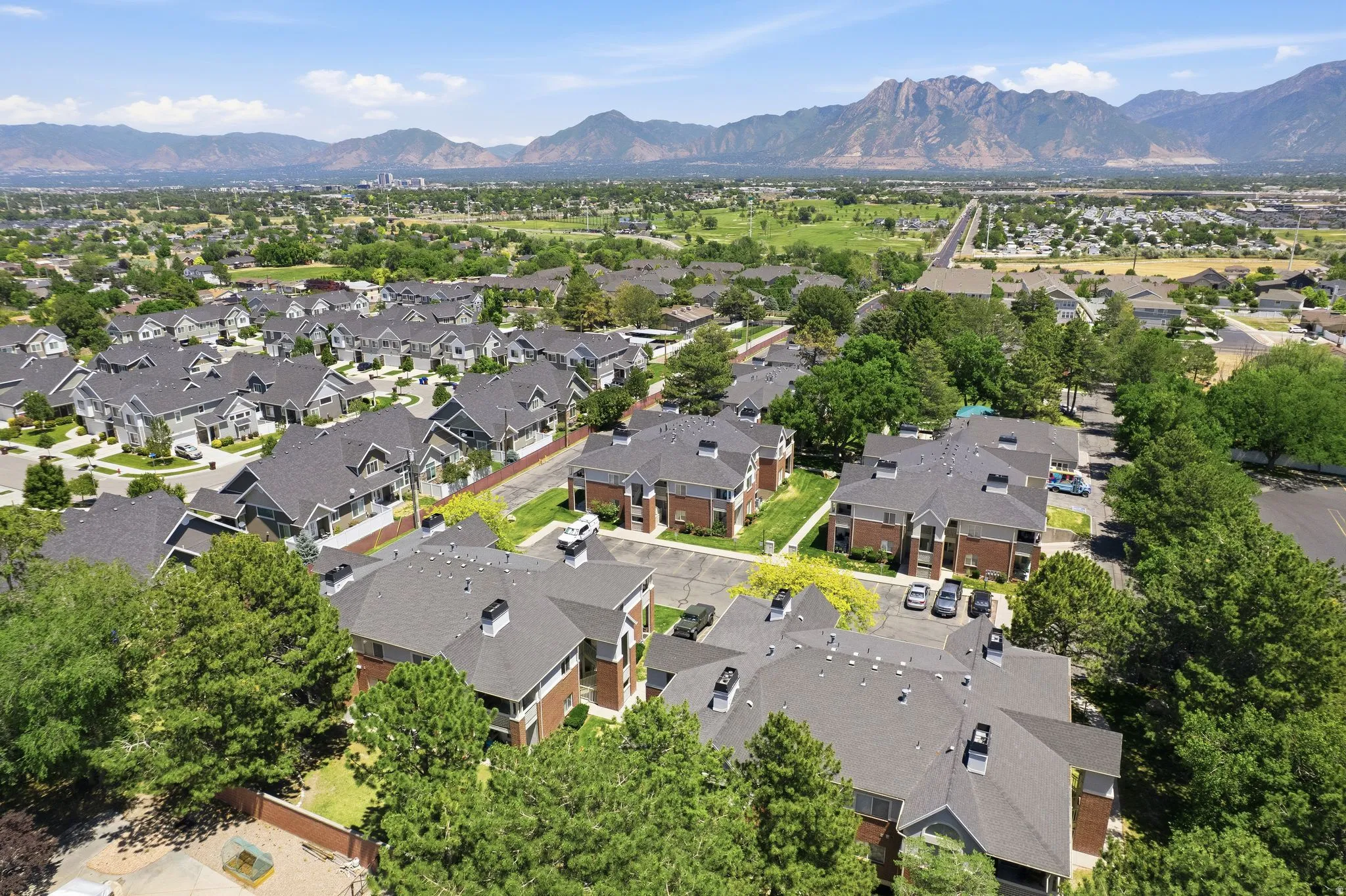 Expansive aerial perspective showcasing a residential community with varied architectural styles