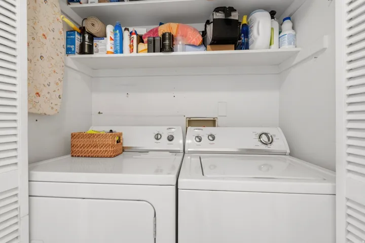 Dedicated laundry closet with shelf