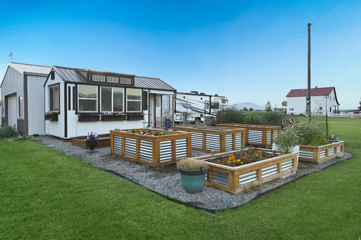Garden shed with raised garden beds.