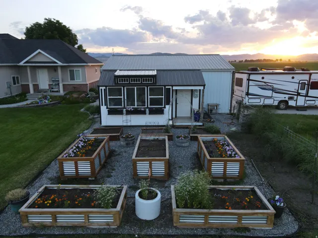 Garden shed with raised garden beds.