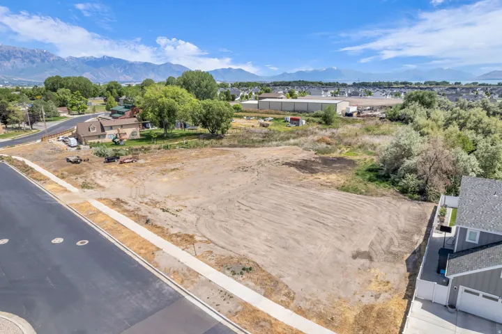 Level lot with direct street access and established sidewalk