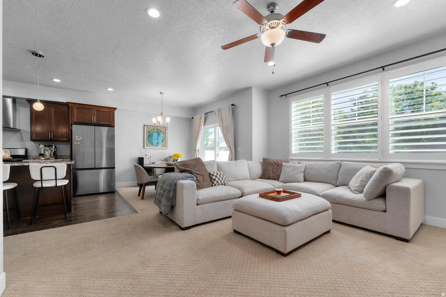 Open-concept living area with integrated kitchen and dining spaces