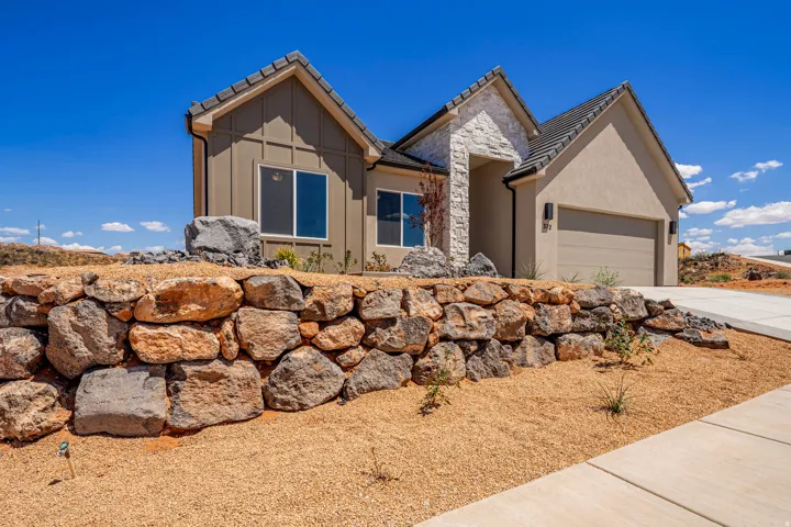 Contemporary exterior featuring board and batten siding and stucco finishes