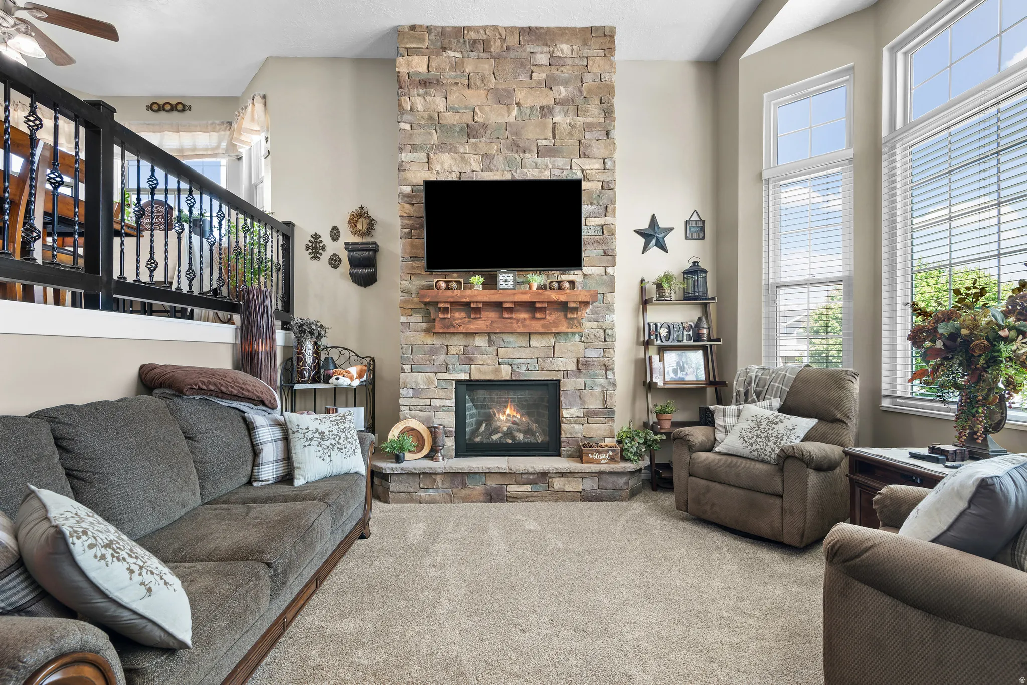 Stone-clad fireplace with a wood mantle and built-in hearth