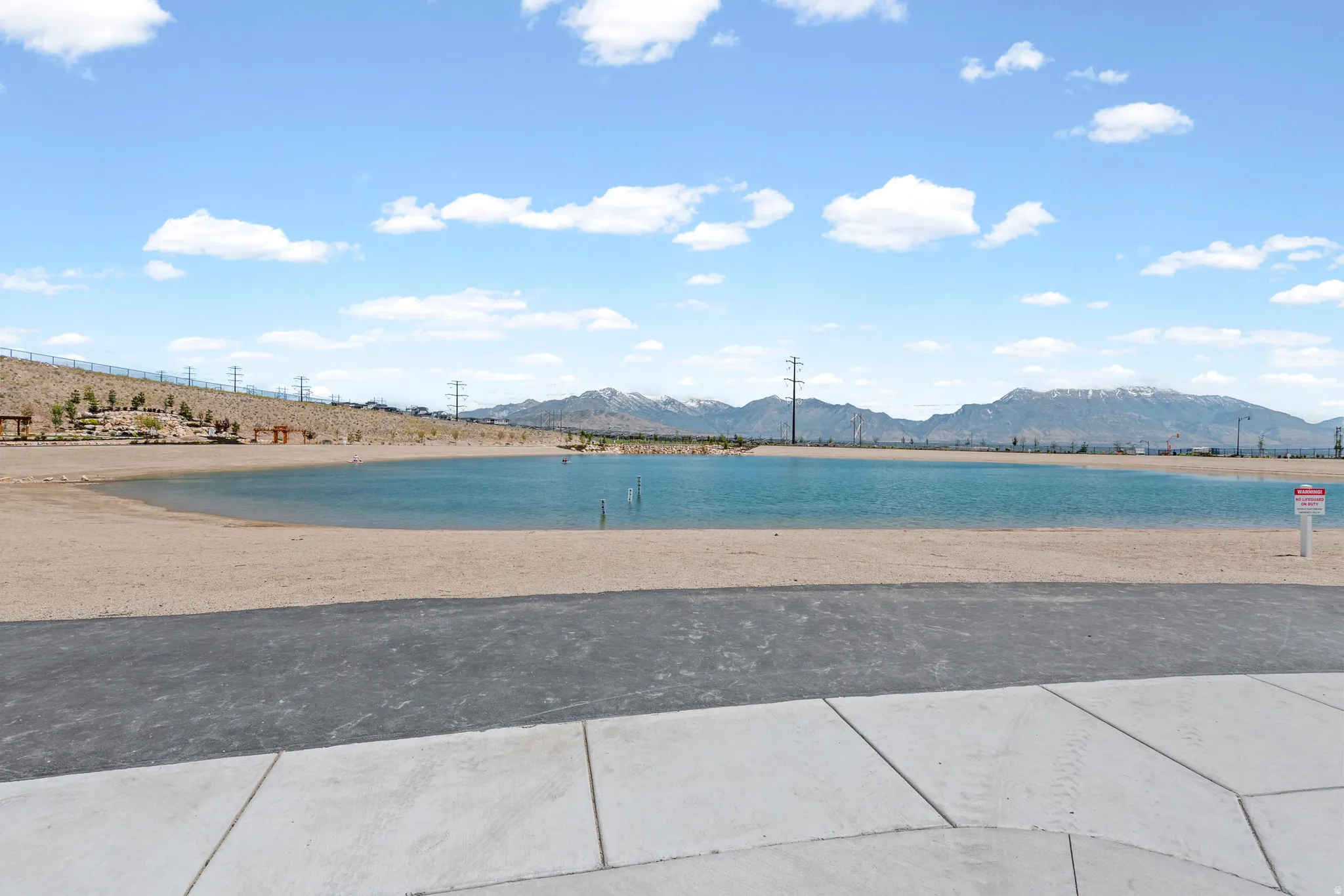 Expansive artificial lake with sandy shoreline