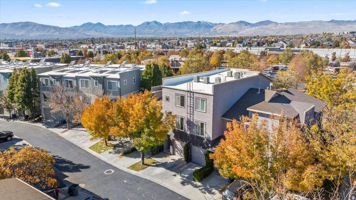 Modern multi-story building featuring a flat roofline and a neutral-toned facade