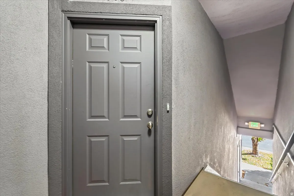 Entrance is up the stairs to the left of the garage.
