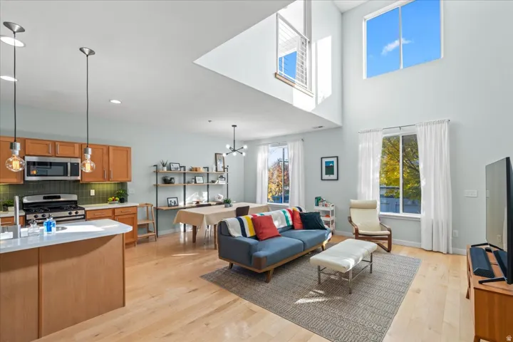 Open-concept living area featuring high ceilings and expansive windows