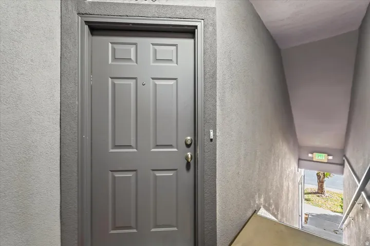 Entrance is up the stairs to the left of the garage.