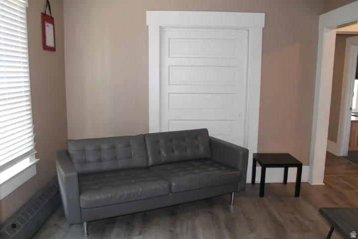 Neutral tone walls complemented by wood-finish flooring