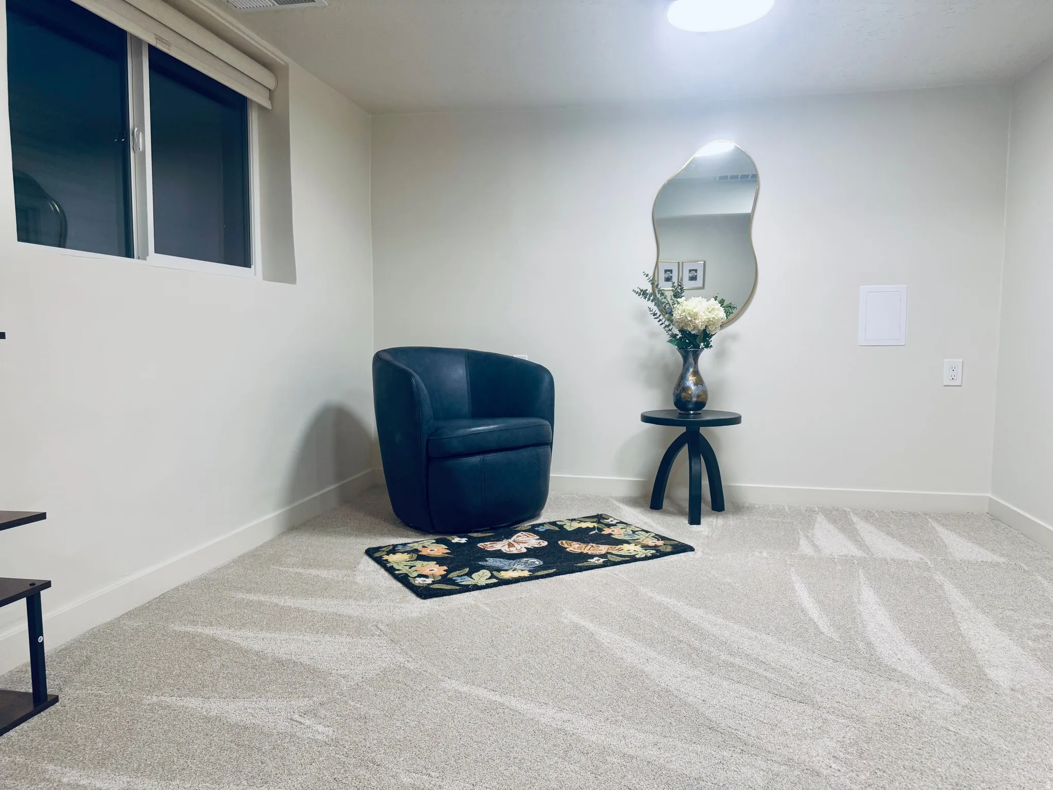 Wall-to-wall carpeting with a light neutral tone