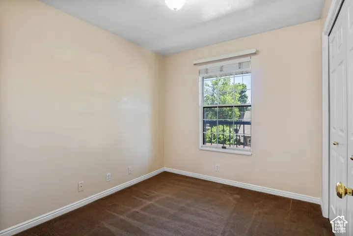 Neutral-toned walls and brown carpet flooring