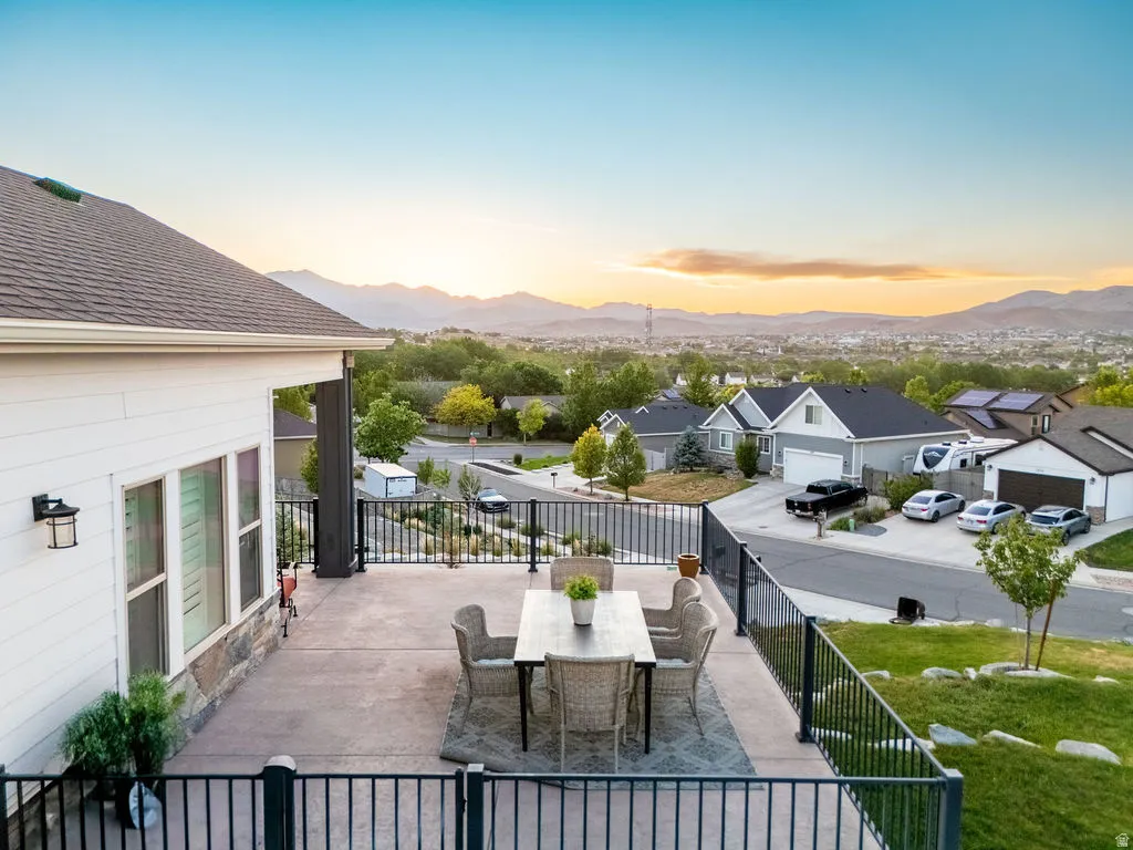 Spacious concrete patio with metal railings