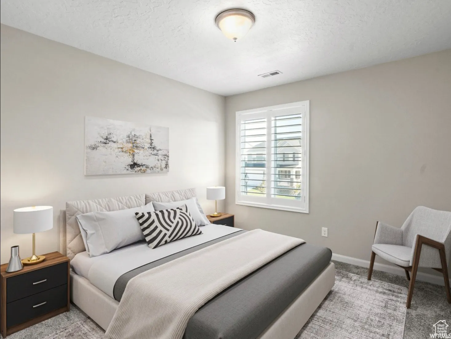Bedroom featuring neutral wall colors, plantation shutters on the window, recessed ceiling light fixture, and carpet flooring