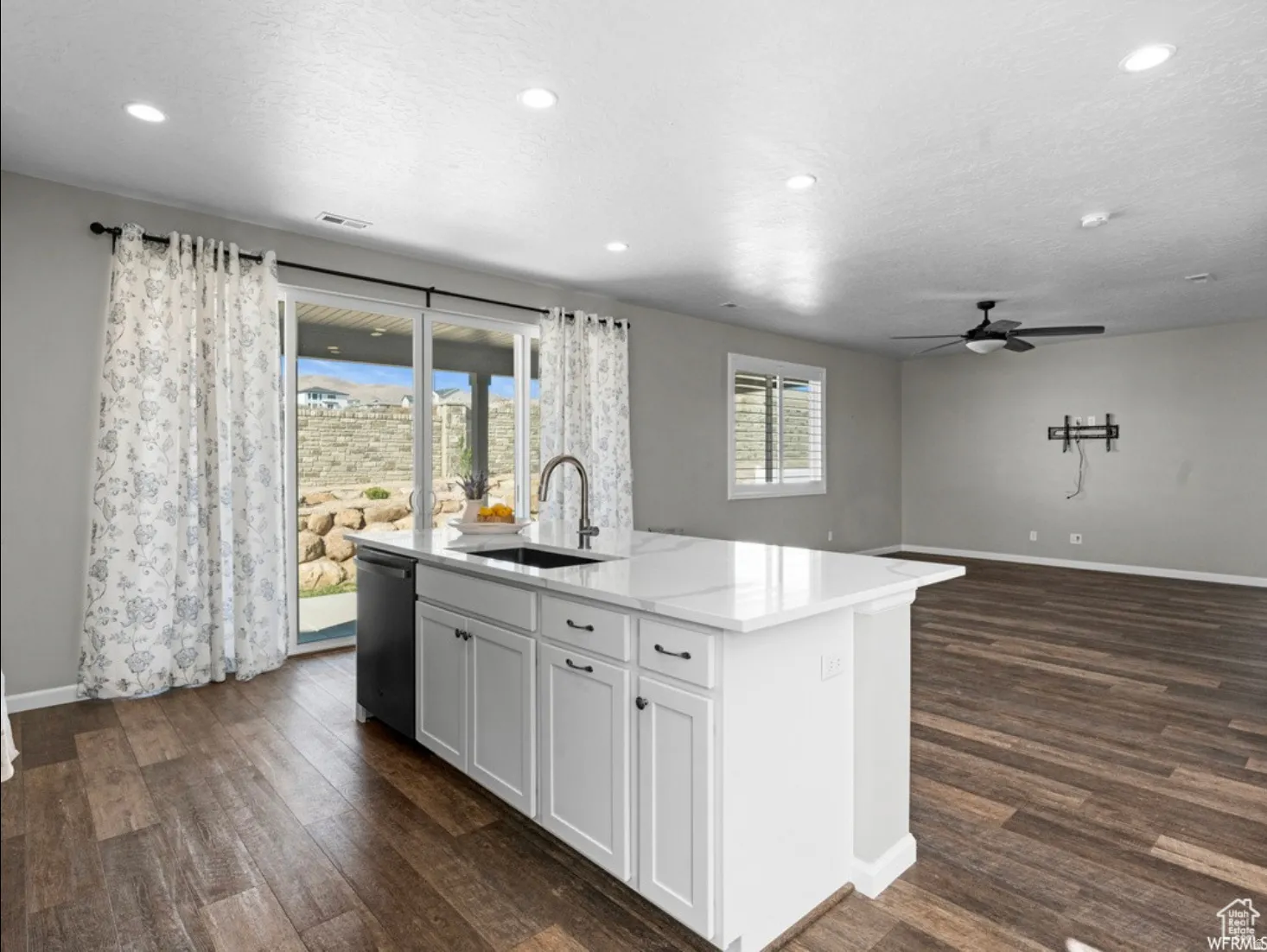 Kitchen island with an undermount sink and a gooseneck faucet