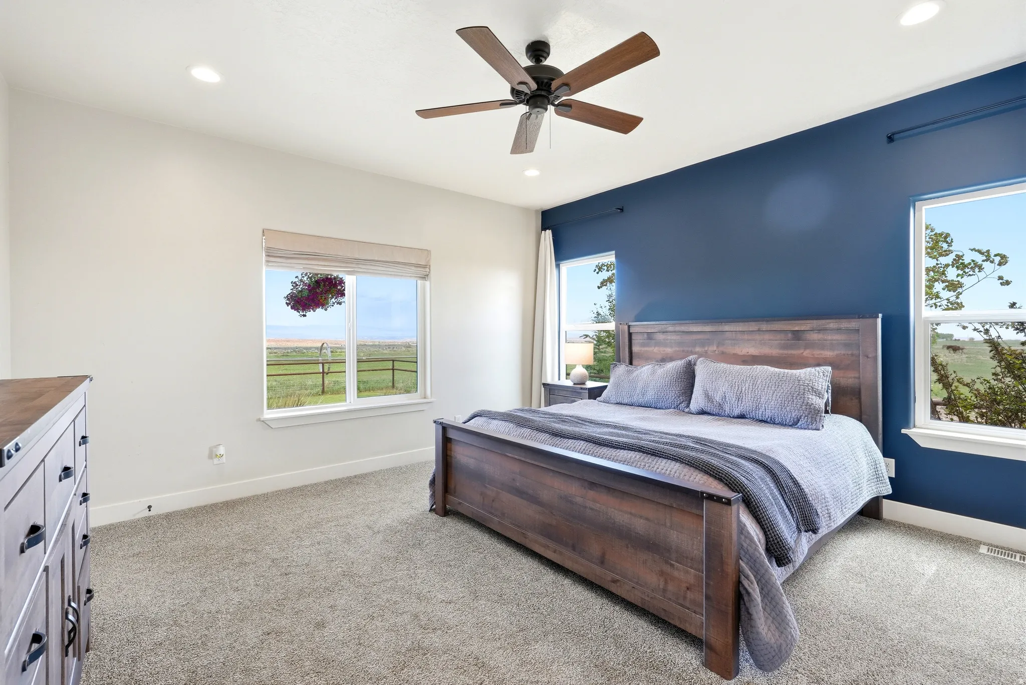Spacious room featuring plush carpeting, recessed lighting, and a ceiling fan