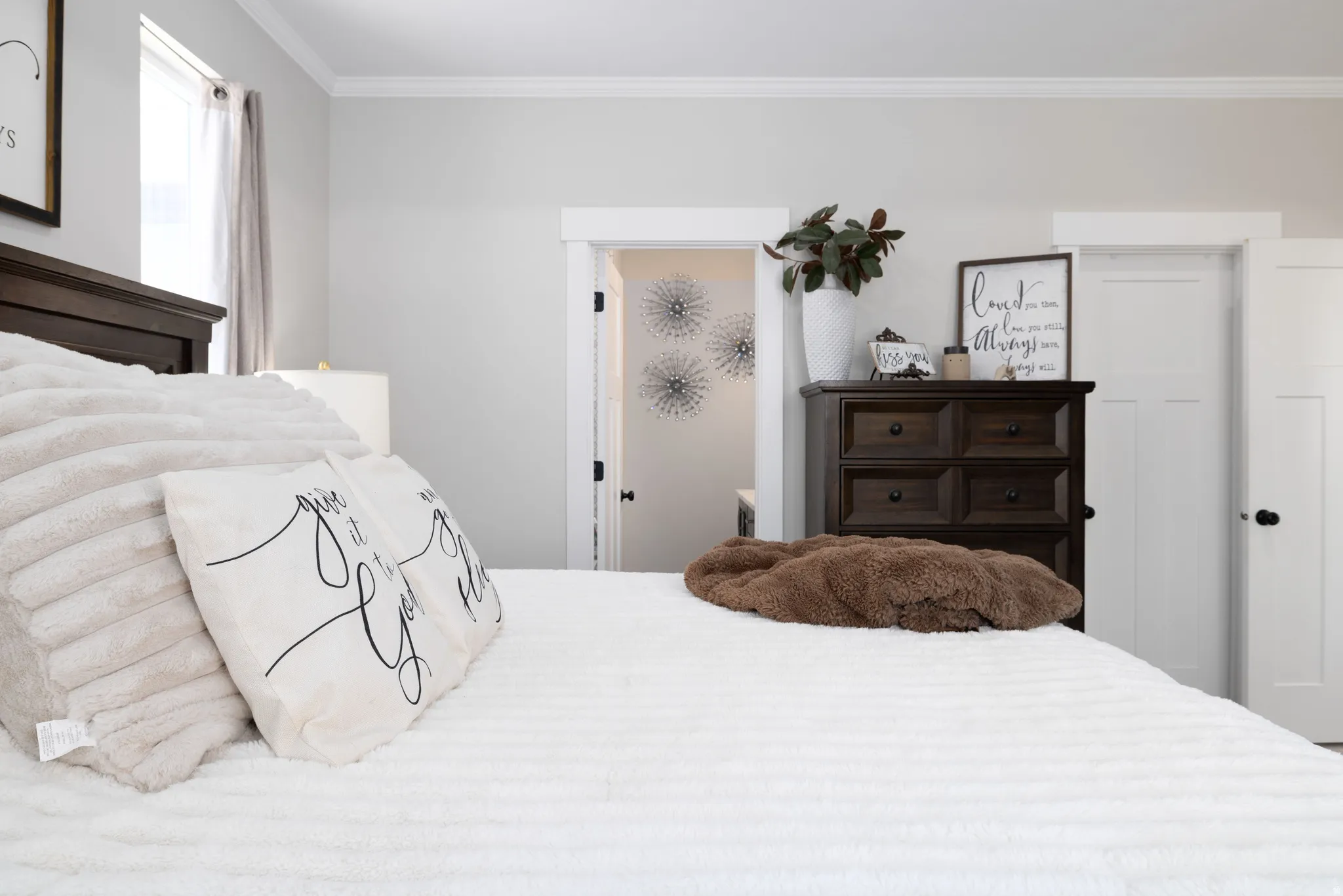 Neutral painted walls with crown molding throughout